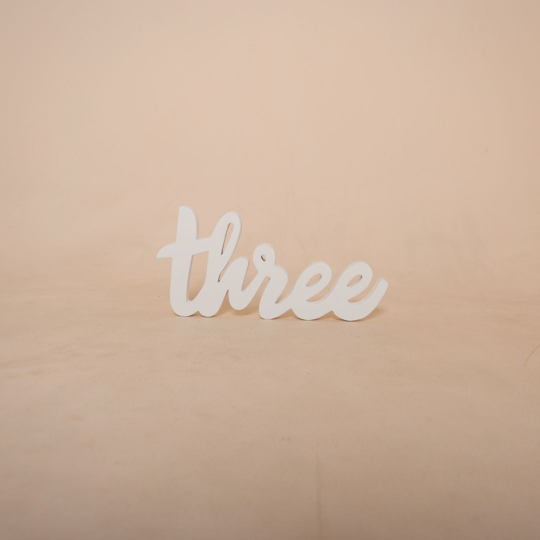 Bright and cheerful Three Birthday Prop featuring a 'three' for third-year photography setups