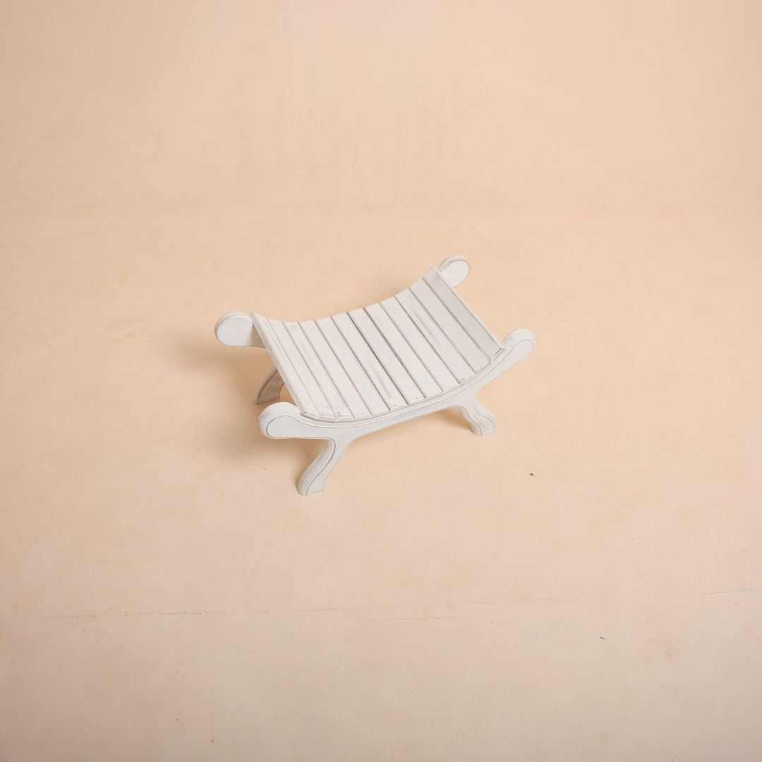 White bench prop for baby photoshoot studio setup