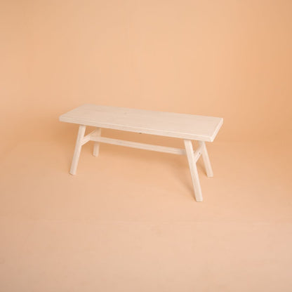 Vintage rustic white bench prop ideal for maternity, sitter, newborn, and fashion portrait sessions in a studio setup.