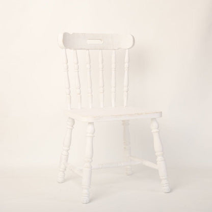 A stylish chair prop, ideal for photoshoots, featuring a classic design and neutral color scheme. The chair adds elegance and sophistication to any scene, making it a perfect accessory for professional photography sessions.