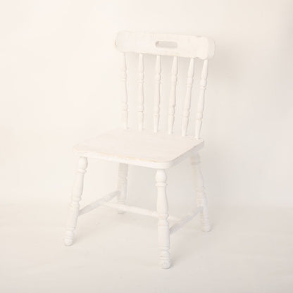 A stylish chair prop, ideal for photoshoots, featuring a classic design and neutral color scheme. The chair adds elegance and sophistication to any scene, making it a perfect accessory for professional photography sessions.
